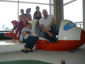 Family sitting on airplane